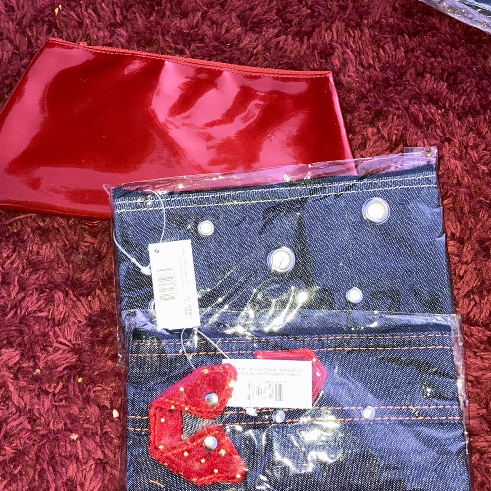 Red hand bag with two blue small handbags